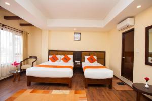 Krevet ili kreveti u jedinici u okviru objekta Hotel Jay Suites