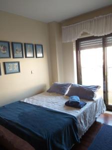 Cama ou camas em um quarto em Avenida 8 apartment