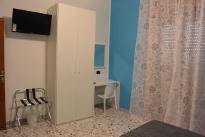 TV/trung tâm giải trí tại B&B Piazza Madonnina +4 ảnh