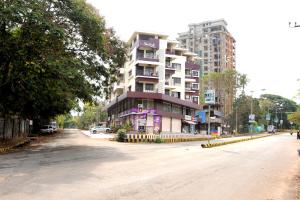 an empty street in front of a tall building at Single Bedroom to rent in Two bedroom apartment in Udupi