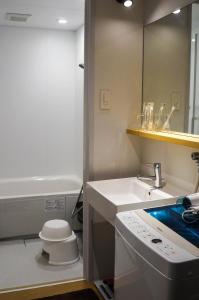 a small bathroom with a sink and a toilet at Hotel Yori Toya / Vacation STAY 24393 in Kyoto
