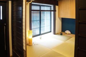 a room with a large window and a floor at Hotel Yori Toya / Vacation STAY 24393 in Kyoto