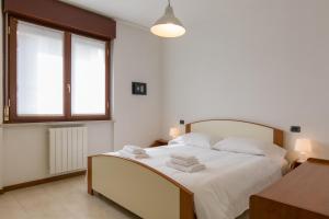Katil atau katil-katil dalam bilik di Appartamento Verona Fiera e Centro