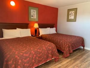 Postel nebo postele na pokoji v ubytování Scottish Inn and Suites - Bensalem-Philadelphia