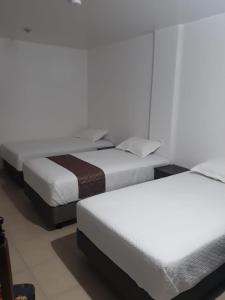 Postel nebo postele na pokoji v ubytování Hotel Kampak Wasi