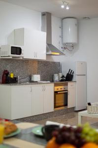 Kuchyň nebo kuchyňský kout v ubytování Apartamentos Océanos + 6 fotografií