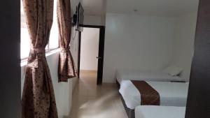 Postel nebo postele na pokoji v ubytování Hotel Kampak Wasi