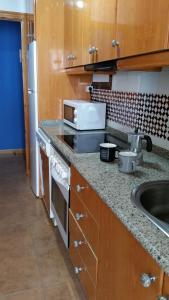 Kuchyňa alebo kuchynka v ubytovaní Apartamento el Atunito, Atlanterra