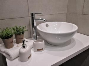 a bathroom sink with a white bowl sink on a counter at Jolen House in Skala Kallirachis +24 photos