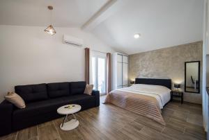 a living room with a couch and a bed at Villa Maja in Cavtat +124 photos