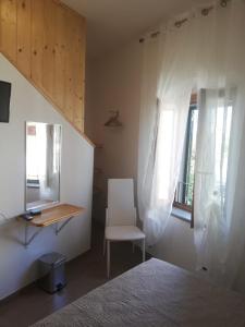 A bed or beds in a room at Il lago del Mugello B&B