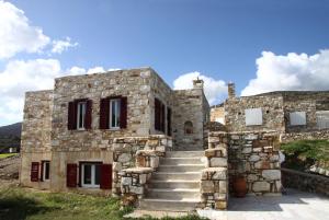an old stone building with stairs in front of it at Stone Villa Kontiani - Red Villa in Dhragoulás