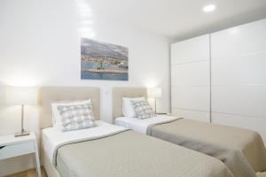 Posteľ alebo postele v izbe v ubytovaní Holiday Home Aspalathos - with free parking, near the beach, a few minutes' walking distance to the UNESCO Palace