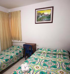 Postel nebo postele na pokoji v ubytování Hotel Real Pólux