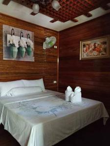Postel nebo postele na pokoji v ubytování BING-VICE Tourist Inn