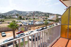 a balcony with a view of a parking lot at Hostal Susi in Peñíscola