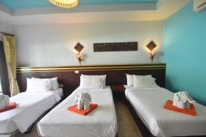 Postel nebo postele na pokoji v ubytování Simple Life Resort Koh Tao