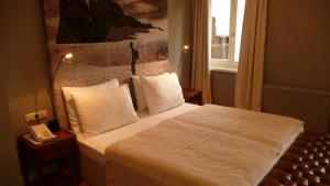 Postel nebo postele na pokoji v ubytování Strandhotel Margaretha