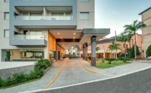 a large building with a road in front of it at Apartamento Veredas do Rio Quente - 919 in Rio Quente