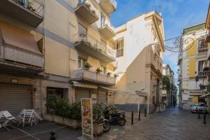 an empty street in a city with buildings at Carla Suite Sorrento in Sorrento