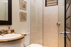 a bathroom with a shower and a sink at Apartment Marichel 4 in Ballito