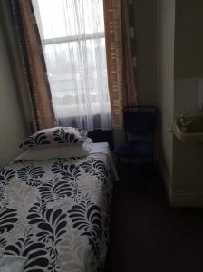 Postel nebo postele na pokoji v ubytování Gretna Hotel Taihape + 2 fotografie