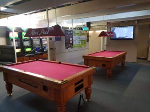 two pool tables on display in a game room at Gretna Hotel Taihape in Taihape