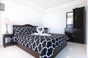 Кровать или кровати в номере Jaynet Oceanview Resort