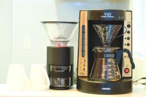 a blender sitting on a counter next to a box at BEACH AND FIELD INN in Sapporo