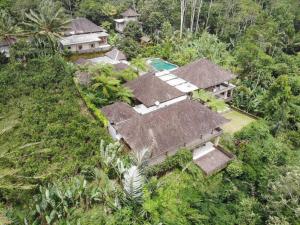 an aerial view of a house in the jungle at Villa Wastra in Payangan