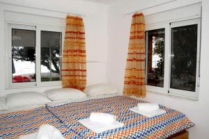 Postel nebo postele na pokoji v ubytování Marina Beach House