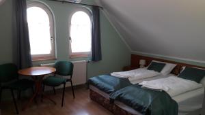 Posteľ alebo postele v izbe v ubytovaní Szalay Villa