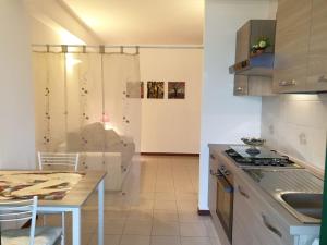 a kitchen with a table and a counter top at Etna View Apartment in Trappitello