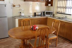 Kuchyň nebo kuchyňský kout v ubytování Farida Apartments