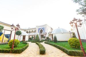 a courtyard of a mosque with lamps and grass at Mirzo Boutique Hotel in Tashkent