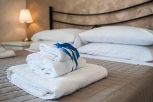 Postel nebo postele na pokoji v ubytování La dimora di Caboto B&B