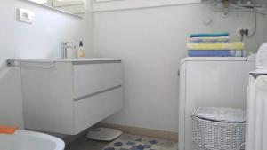 a bathroom with a sink and a toilet at Casa Azalea in Verbania