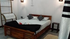 Postel nebo postele na pokoji v ubytování Sigiri Veenus Paradise