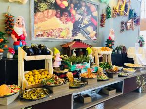 a buffet of fruits and vegetables on a table at Ruth Daniel Residence in Tel Aviv