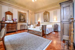 Postel nebo postele na pokoji v ubytování Hotel Villa Beccaris