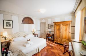 Postel nebo postele na pokoji v ubytování Hotel Villa Beccaris