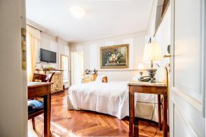 Postel nebo postele na pokoji v ubytování Hotel Villa Beccaris