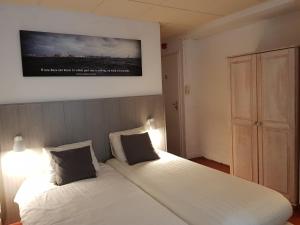 Postel nebo postele na pokoji v ubytování Hotel Le Provencal