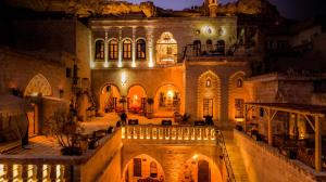 an old building with lights in front of it at night at Selçuklu Konağı in Mardin