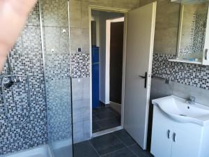 a bathroom with a shower and a sink and a toilet at Guesthouse Porec in Poreč