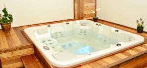 a jacuzzi tub in a room with at Popasul Domnesc- Resort& Spa- Voronet Vue in Voronet