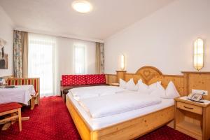 Posteľ alebo postele v izbe v ubytovaní Hotel Serles