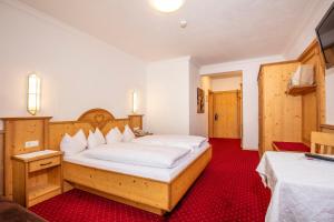 Posteľ alebo postele v izbe v ubytovaní Hotel Serles