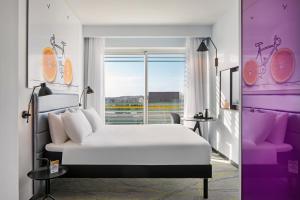 a bedroom with a white bed and a window at Ibis Styles Jerusalem City Center - An AccorHotels Brand in Jerusalem