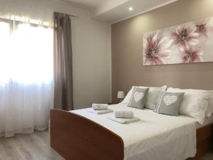 Postel nebo postele na pokoji v ubytování Villa Roso + 37 fotografií